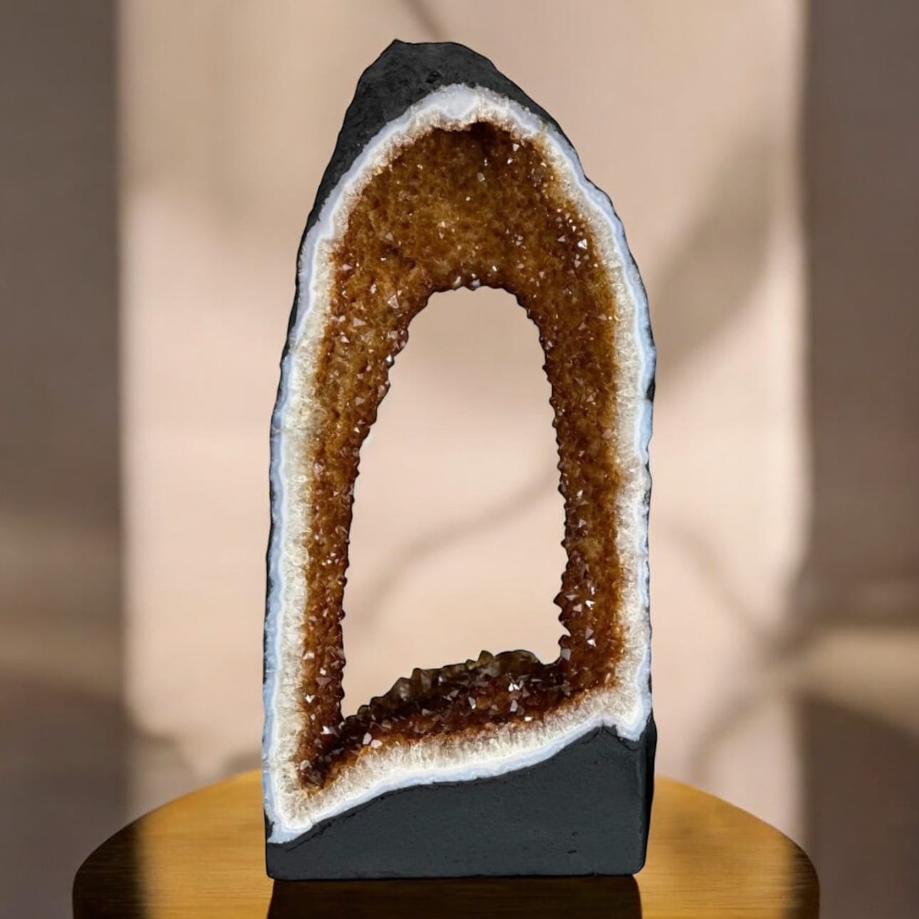 Polished amethyst crystal with reflective surface